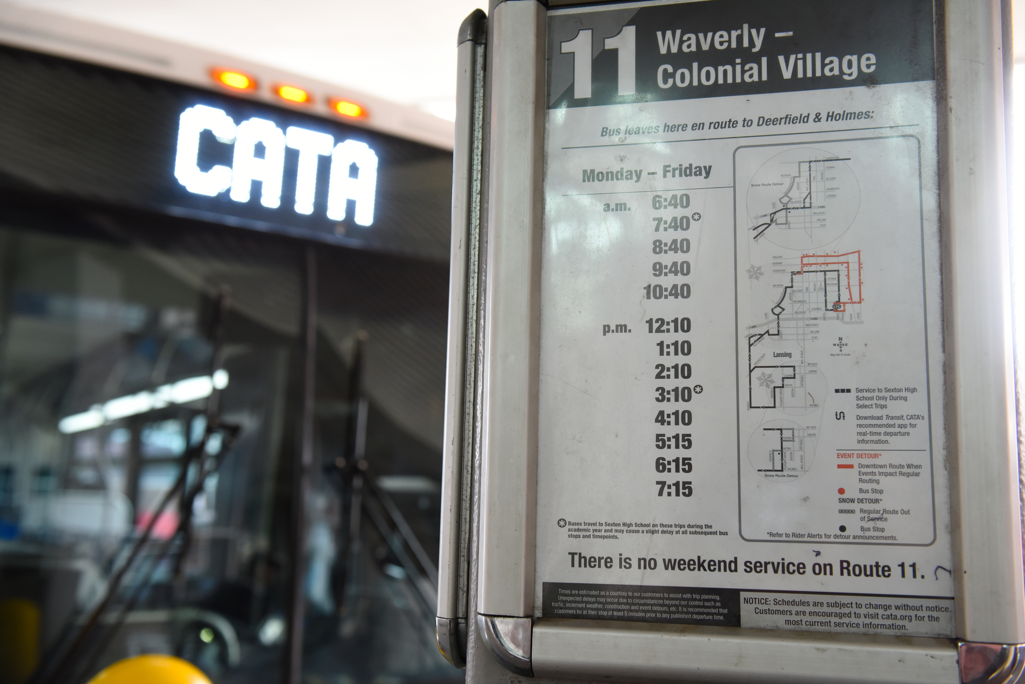 Bus stop schedule for Route 11 Waverly–Colonial Village displayed inside a CATA bus, showing weekday departure times and notice of no weekend service