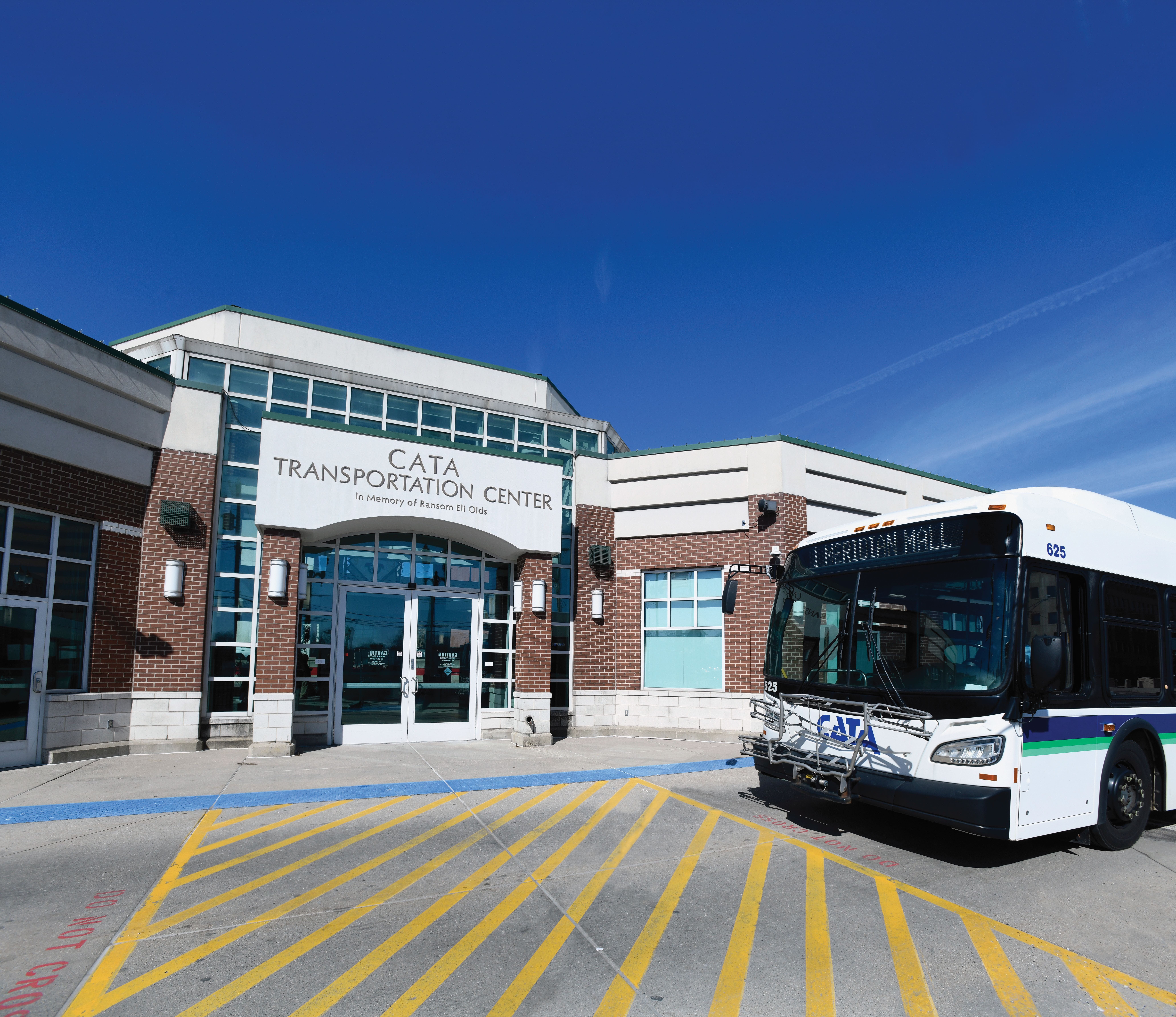 A bus parked in front of the CATA Transportation Center