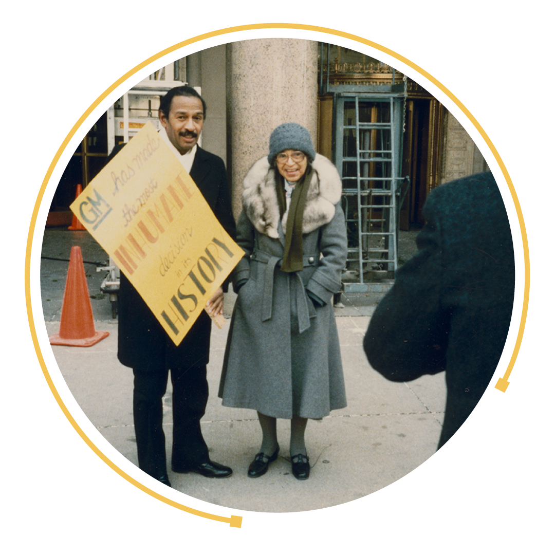 Rosa Parks standing with Congressman John Conyers