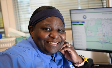 CATA Customer Experience Representative smiling at desk