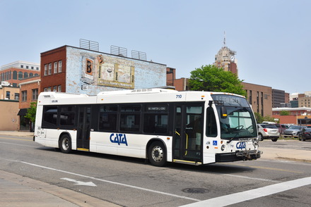A bus driving down the street