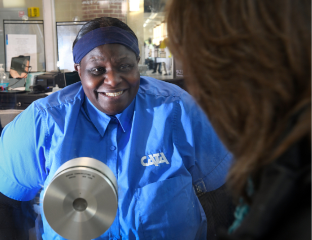 A CATA customer experience representative helping a customer