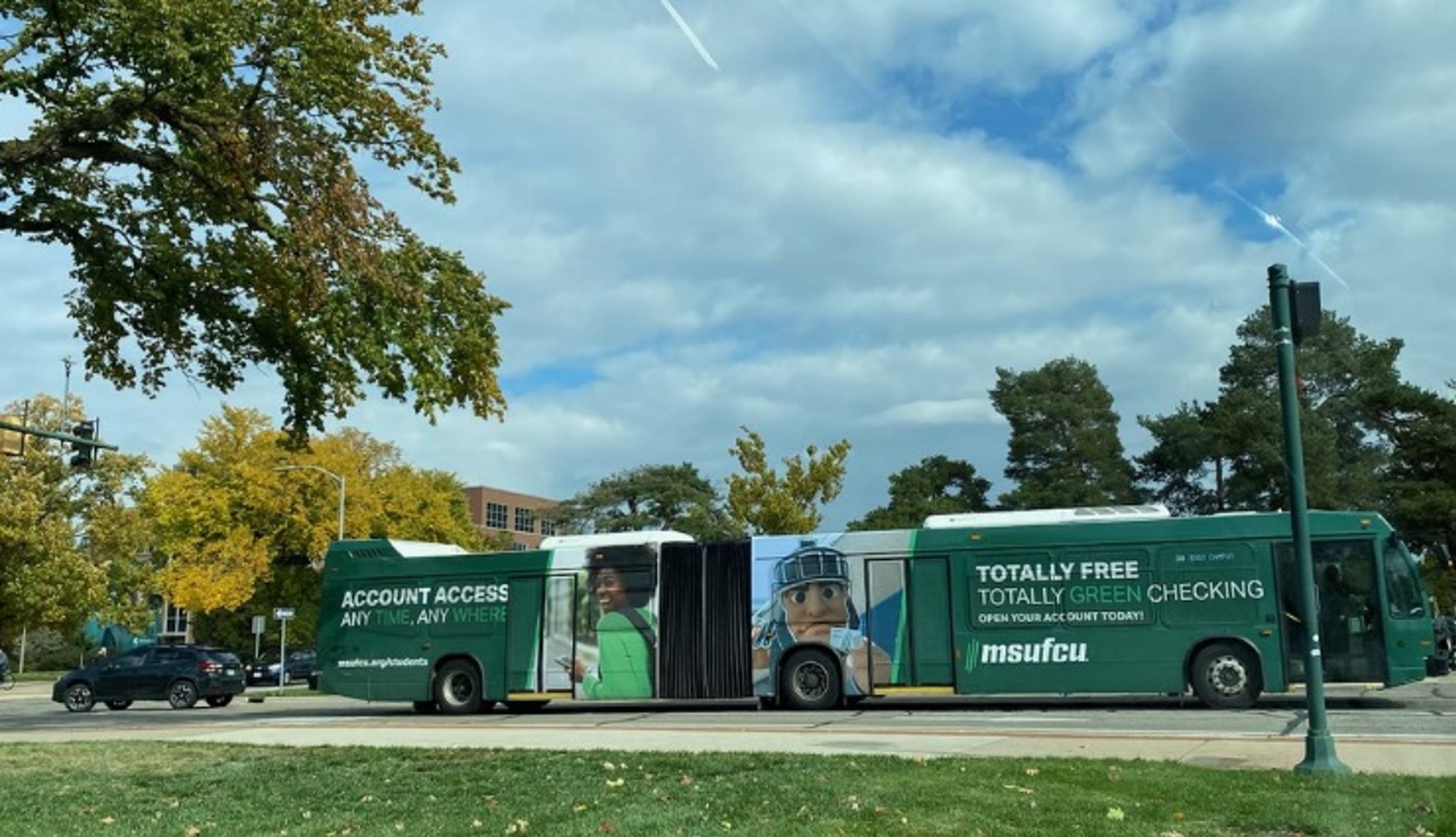 A 60 foot bus with a full wrap advertisement on it