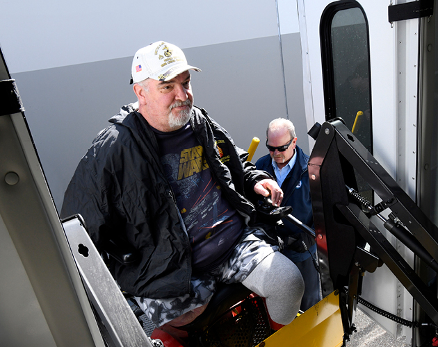 Lance Thomas boarding a CATA vehicle in a wheelchair