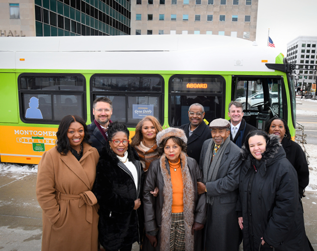 Members of the community in front of the Rosa Parks tribute bus