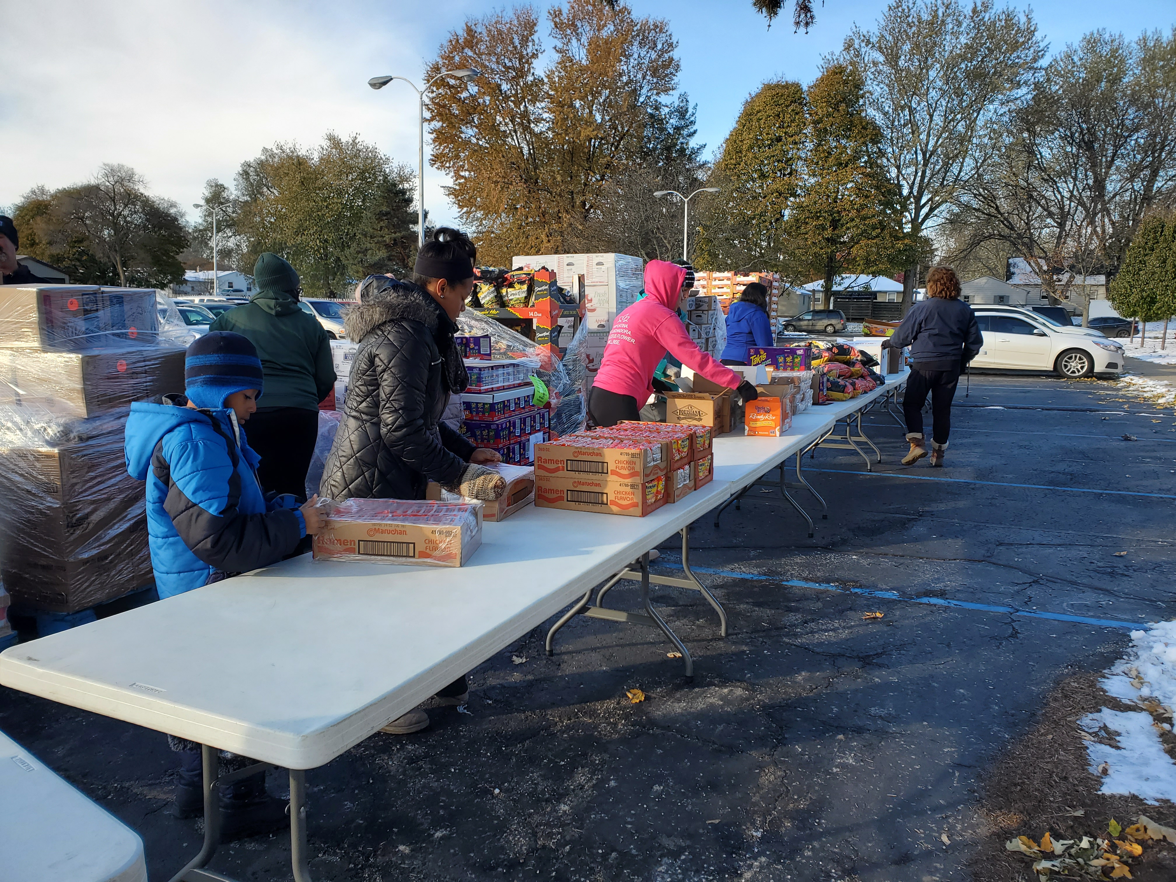 they launched a six-hour bus run to the South Church of the Nazarene, November’s mobile food bank location. On a chilly, 20 degree day, volunteers of all ages set up food while our Spec-Tran picked up clients.