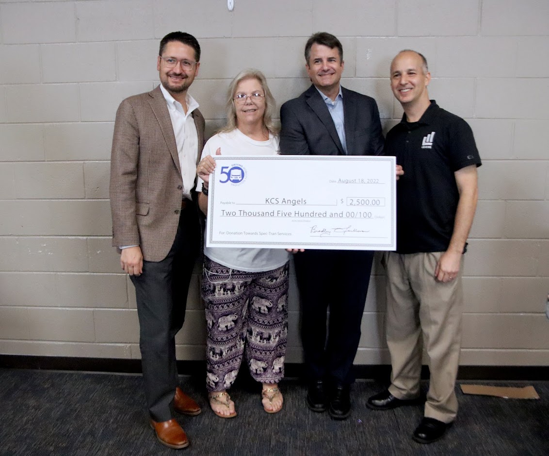 CATA and KCS Angels standing with large donation check