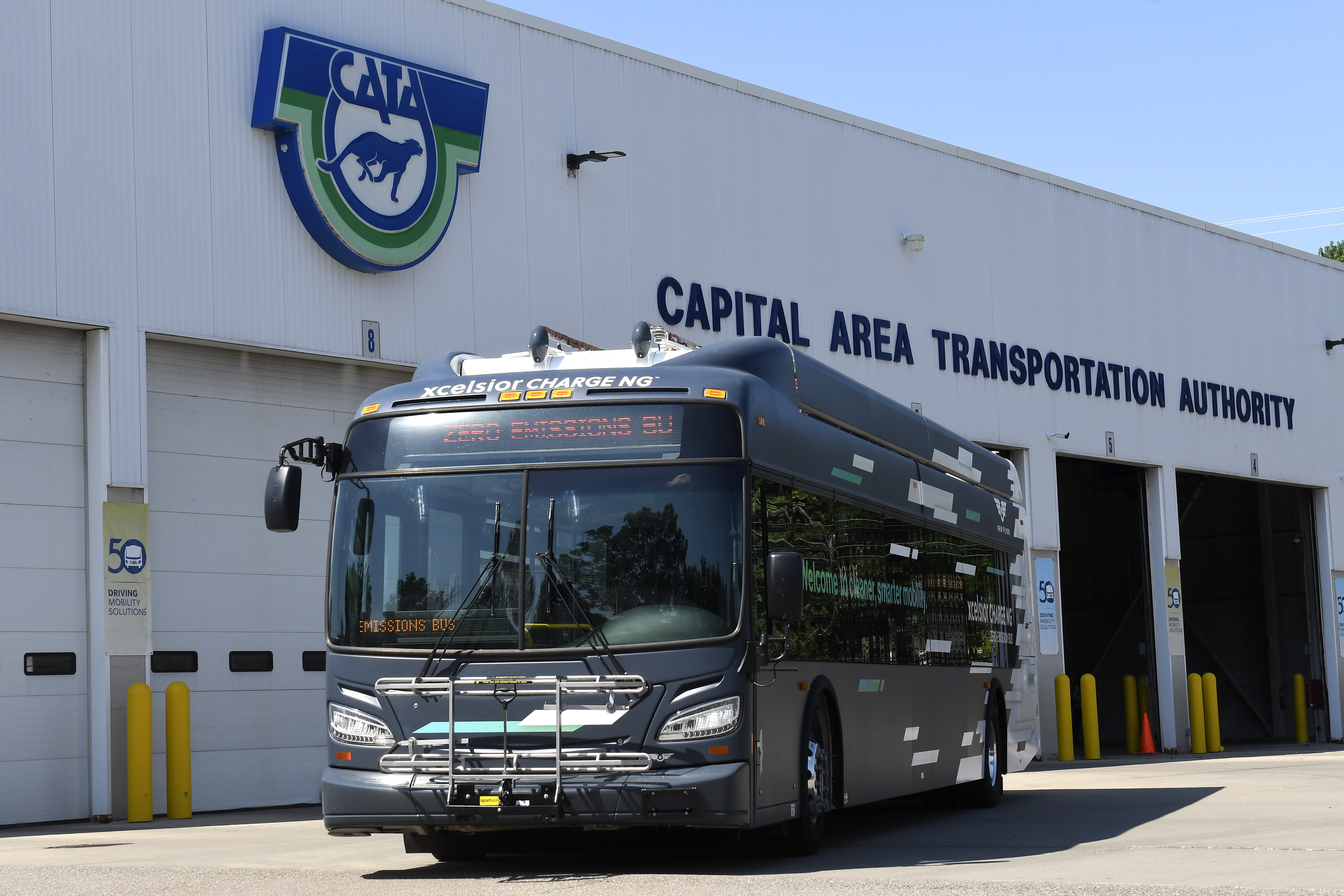 Electric Bus sitting in front of CATA facility
