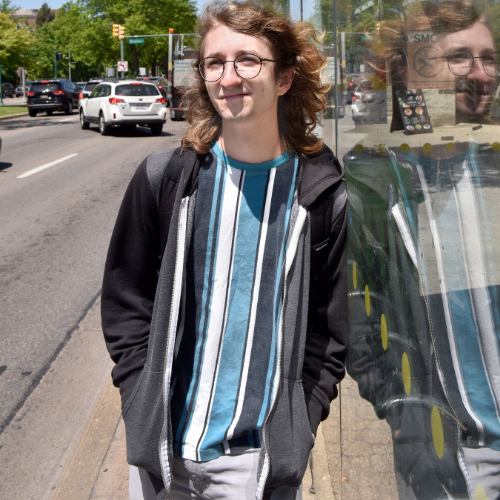 Someone waiting outside a CATA bus shelter