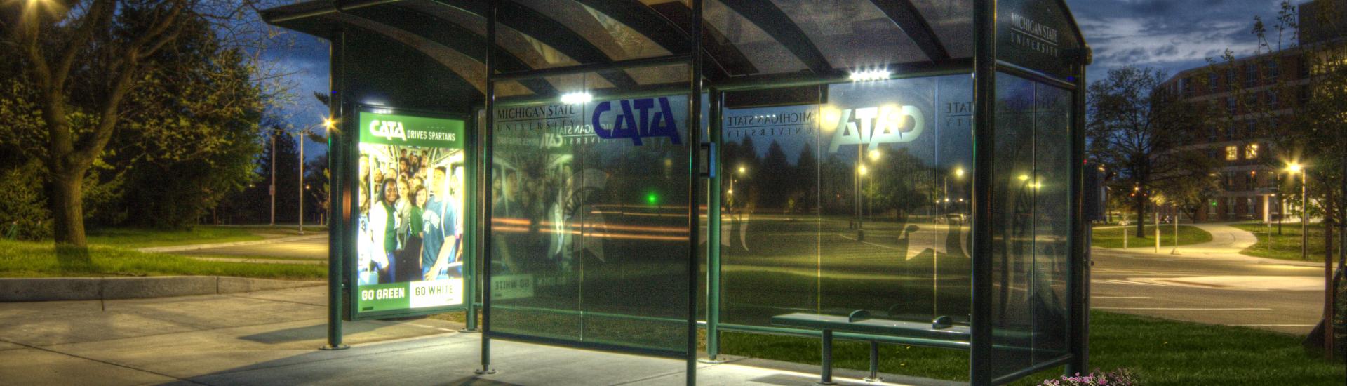 image of MSU bus shelter at night