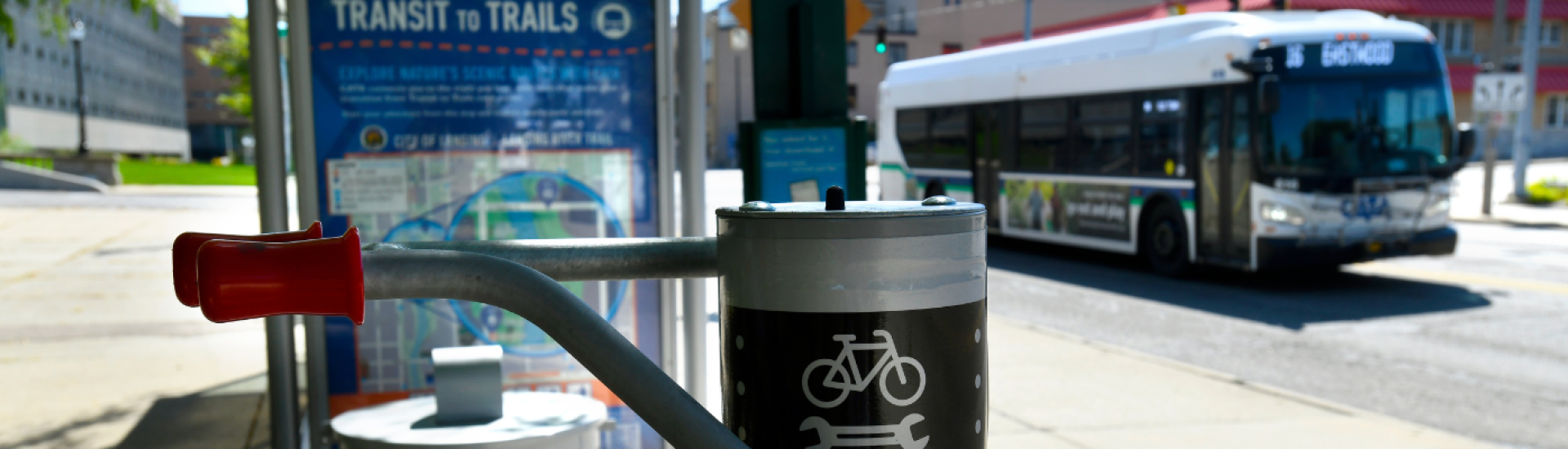Bike repair station in front of a CATA Transit to Trails shelter and bus