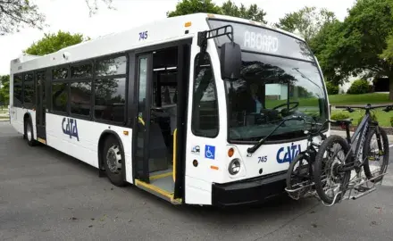 CATA bus with bikes on the bike rack with the sign saying welcome aboard