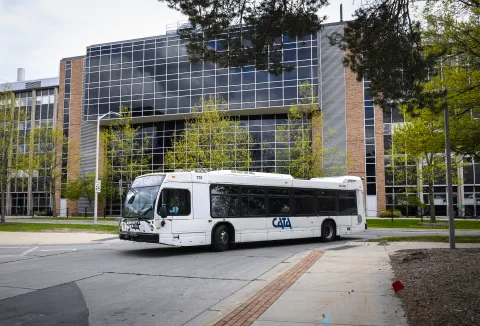 CATA Route 32 bus on MSU's campus entering Ramp 1