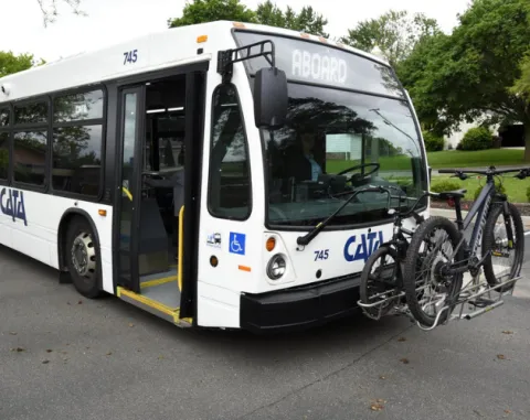 CATA bus with bikes on the bike rack saying welcome aboard
