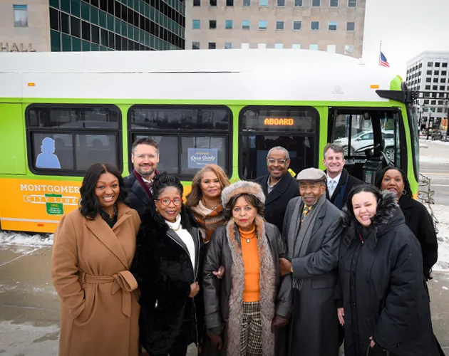Members of the community in front of the Rosa Parks tribute bus