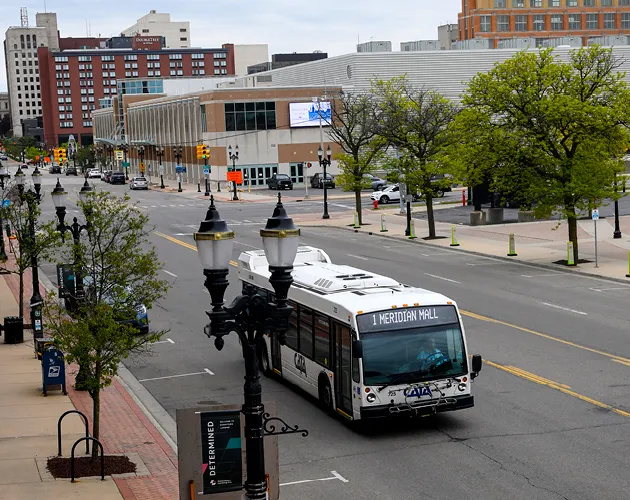 CATA's Route 1 bus driving down Michigan Avenue in Downtown Lansing