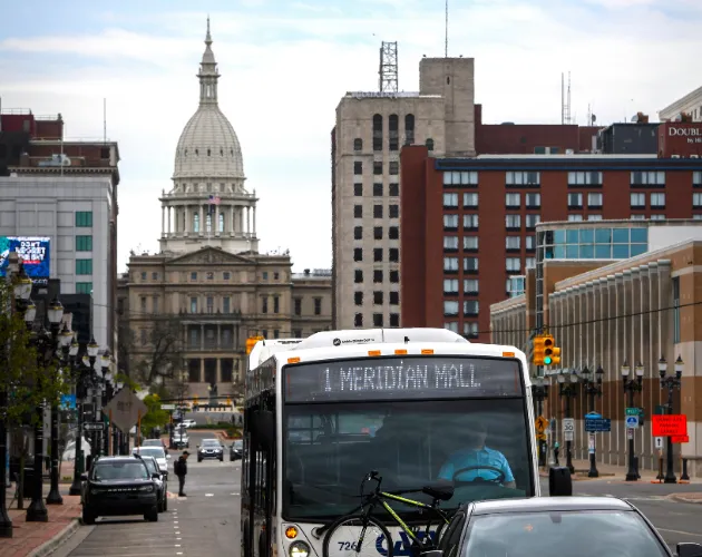 CATA's route 1 driving in front of the Capitol Building in downtown Lansing